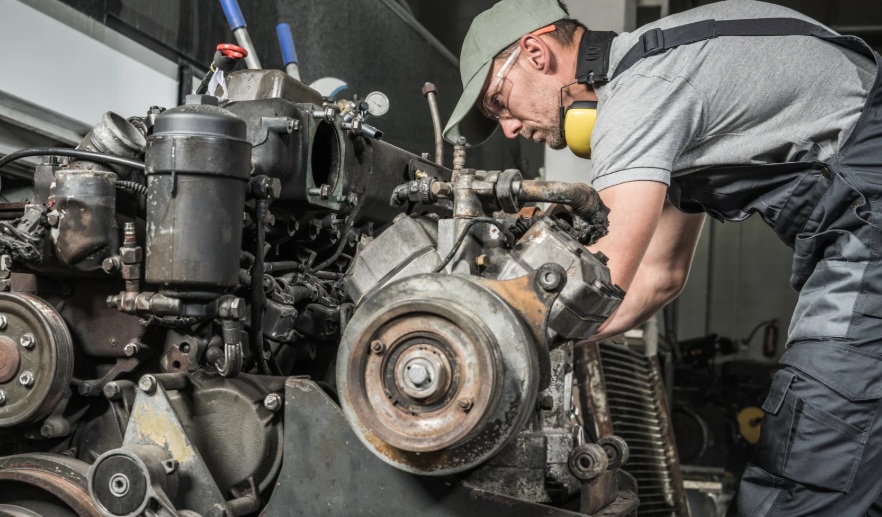 Engineer inspecting an engine